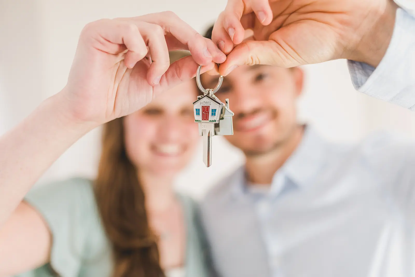 Home buyers holding keys.